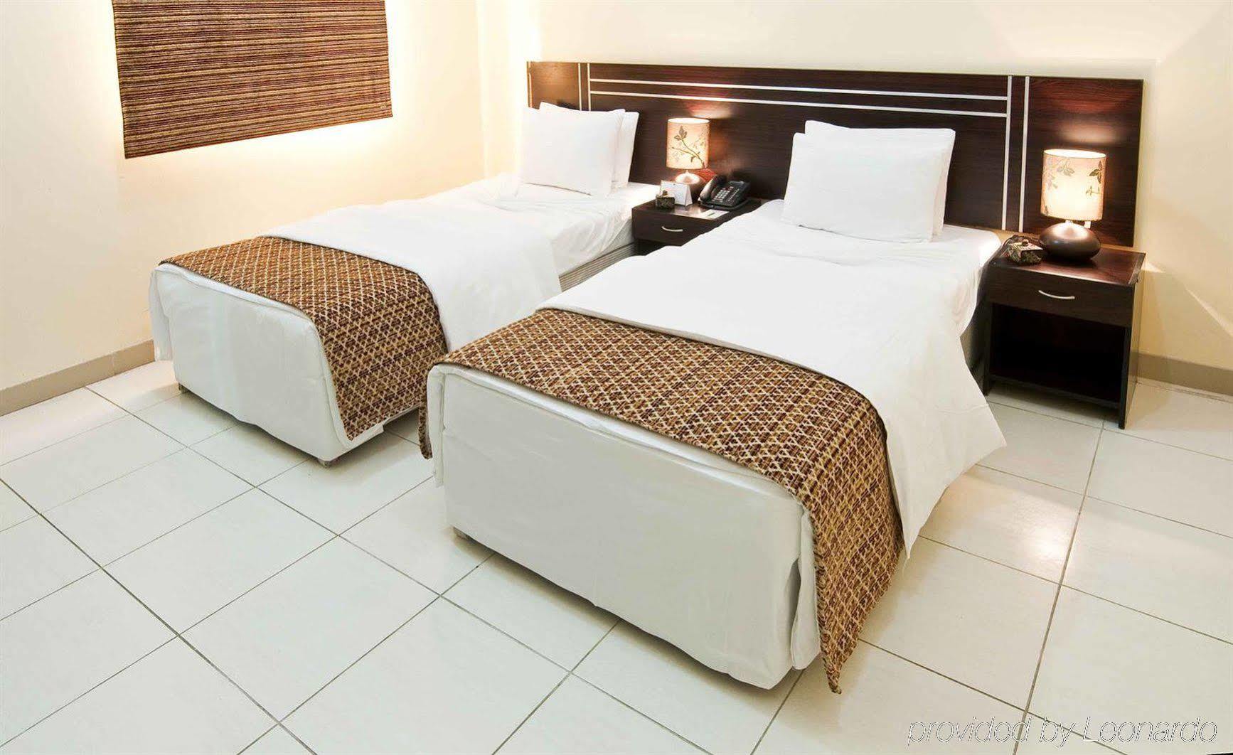 La Villa Hotel Doha Kamer foto